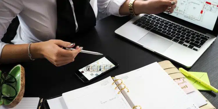 Person Pointing on the Screen of a Laptop