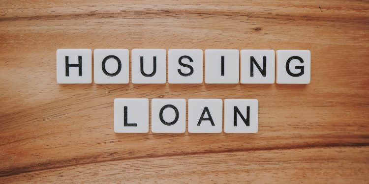 housing loan blocks on brown wooden surface